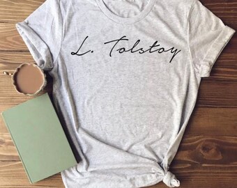 May include: A gray t-shirt with the text "L. Tolstoy" written in black cursive script.