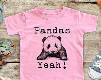 May include: Pink toddler t-shirt with a black and white panda illustration and the text "Pandas Yeah!"