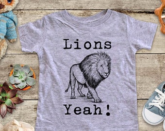 May include: A gray short-sleeved t-shirt with a black and white illustration of a lion and the text "Lions Yeah!"