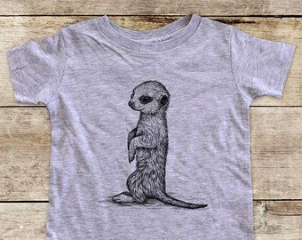 May include: A heather grey short-sleeved t-shirt with a black and white illustration of a meerkat standing on its hind legs.