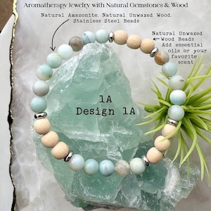 May include: Aromatherapy bracelet featuring natural amazonite gemstones, natural unwaxed wood beads, and stainless steel beads. The bracelet is design 1A. The wood beads can be used with essential oils or your favorite scent.