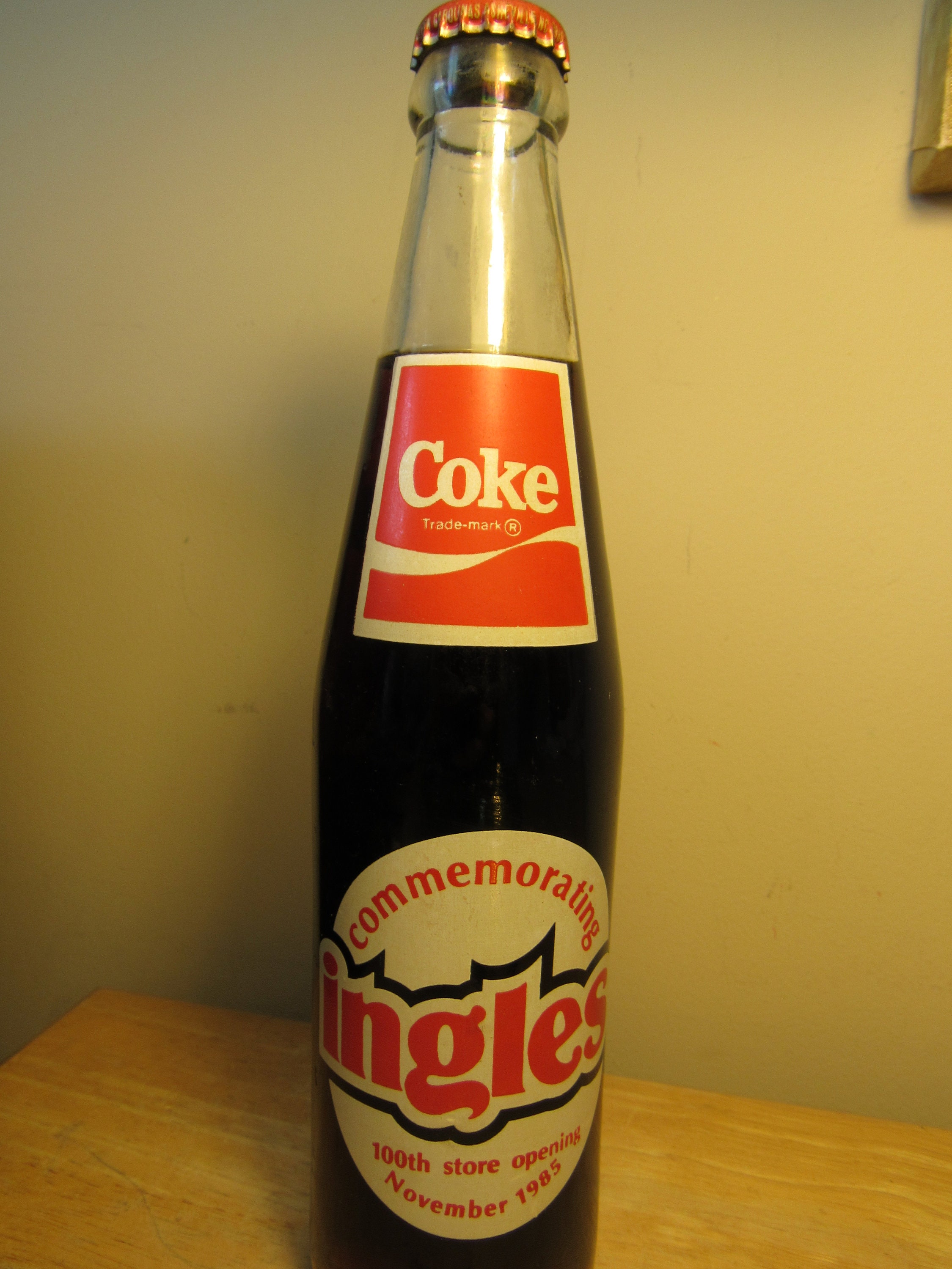 10 OZ COCA COLA COMMEMORATIVE BOTTLE - 1985 INGLES 100TH STORE OPENING