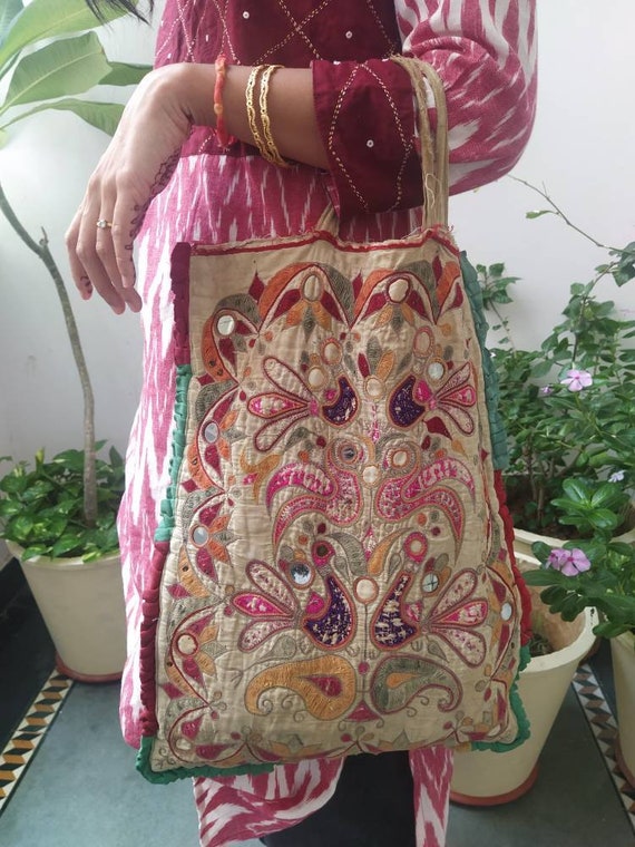 Vintage theli bag with handembroidery and figures,