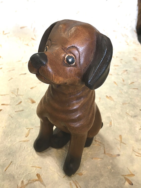 carved wooden dog
