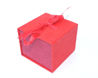 Red box with ribbon for christmas gifts, jewelry small money