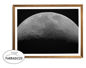 May include: A black and white photograph of the moon in a wooden frame.