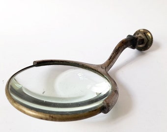 Very Old Magnifying Glass. Collectible Vintage Magnifier with Metal Structure.