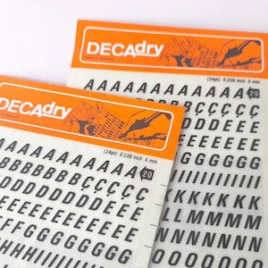 Vintage Set of Two Instant Rub on Letter Transfers from Decadry. Vintage Letters Stencil. Vintage Graphic Design.