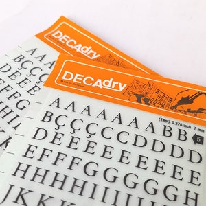 Vintage Set of Two Instant Rub on Letter Transfers from Decadry. Vintage Letters Stencil. Vintage Graphic Design.