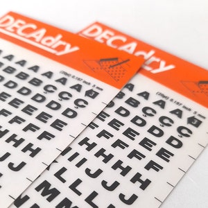 Vintage Set of Two Instant Rub on Letter Transfers from Decadry. Vintage Letters Stencil. Vintage Graphic Design.