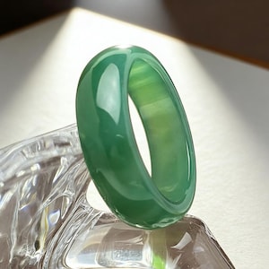 May include: A set of three ceramic mugs with a speckled, matte finish in cream, light grey, and dark grey. Each mug has a simple, minimalist design, suitable for coffee or tea.