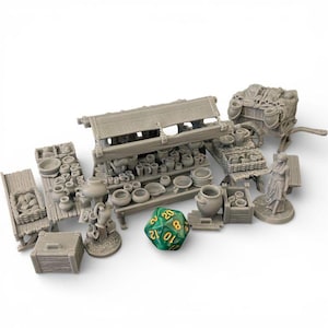 May include: A collection of miniature gray market stalls, shelves, and carts filled with small pottery, jugs, and bowls. A green and yellow twenty-sided die is in the foreground. The scene evokes a medieval or fantasy setting.