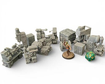 May include: A collection of miniature gray industrial machines, including lathes, presses, and other factory equipment. A small figurine and a green die are also present, suggesting a tabletop gaming theme.