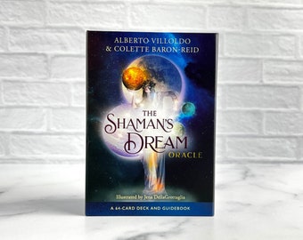 May include: The Shaman's Dream Oracle deck and guidebook box features a dark blue space background with planets and a central figure holding a glowing orange sphere. Text includes the authors' names, the title, and A 64-CARD DECK AND GUIDEBOOK.