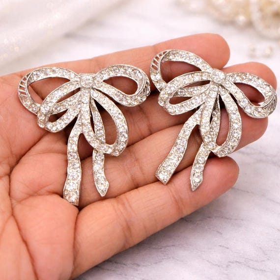 Vintage Pot Metal Bow Ribbon Clip On Earrings Silver Tone Clear Clear Rhinestone