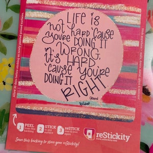 May include: Pink and gold striped background with a pink circle containing the text "LIFE is not hard 'cause you're doing it WRONG. It's HARD 'cause you're doing it RIGHT."  The text is in black with a white outline. The text "Untamed" and "Glennon" are written in smaller font below the circle. The text "reStickable Photo" is in the top left corner of the image. The text "reStickity" is in the bottom right corner of the image.