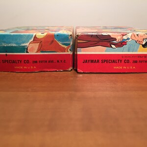 May include: Two red and white cardboard boxes with the text "JAYMAR SPECIALTY CO. 200 FIFTH AVE., N.Y.C. MADE IN U.S.A." printed on the bottom. The box on the right has the additional text "MCMLXVII Walt Disney Productions" printed on the bottom.
