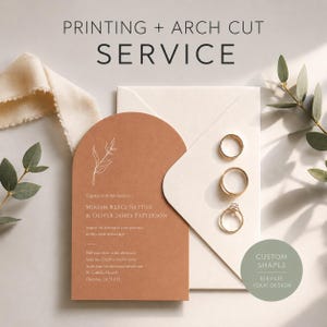 May include: An arch-cut terracotta wedding invitation with white text and a line-art botanical illustration, placed on a cream envelope with three gold rings. The text reads PRINTING + ARCH CUT SERVICE and CUSTOM SHAPES ELEVATE YOUR DESIGN.