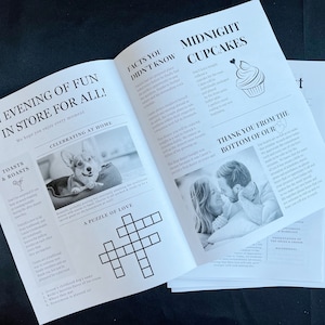 May include: A stack of printed wedding stationery with newspaper-style layouts. Headlines include "An Evening of Fun is in Store for All!" and "Midnight Cupcakes." Black and white photos and a crossword puzzle are also featured.