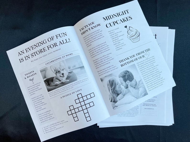 May include: A stack of printed wedding stationery with newspaper-style layouts. Headlines include "An Evening of Fun is in Store for All!" and "Midnight Cupcakes." Black and white photos and a crossword puzzle are also featured.