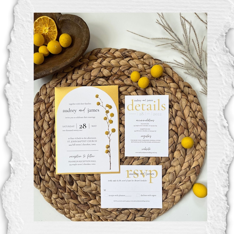 May include: A wedding invitation suite with a yellow and white color scheme. The invitation features a floral illustration and the text "Audrey and James" in a script font. The details card includes the date, time, and location of the wedding. The RSVP card has a simple design with the couple's names and a space for guests to indicate their attendance.