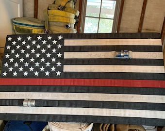 Fire Hose Flag with the thin red line. Great firefighter flag for wall art. Perfect firefighter gift or retirement gift