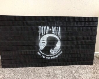 Fire Hose Flag showing off the POW flag. Great wall art for home decor or wall decor. Perfect gift for Vietnam war veteran or gift for dad.