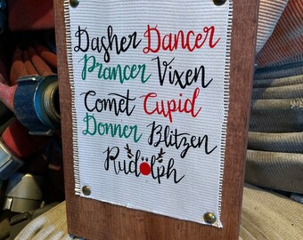 Fire Hose Sign with all the Christmas reindeer. Great Christmas sign or wall sign for Christmas decor, wall decor or home decor.