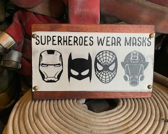 Fire Hose Sign with super hero firefighter or fireman. A great firefighter gift or fireman gift. A Perfect custom sign or personalized sign.