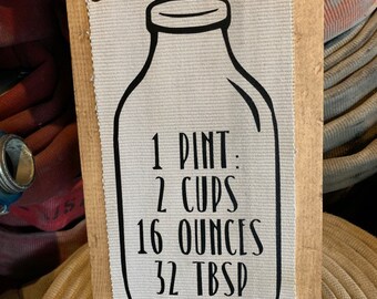 Fire Hose Sign with a pint glass conversion chart showing off a farmhouse style sign. Great farmhouse decor, kitchen decor or wall decor.