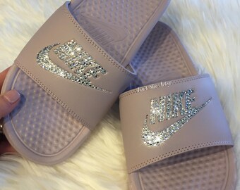 white and rose gold nike slides