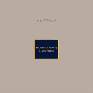 May include: A navy blue square with a gold border, the text "HAVING A MOVIE MARATHON" in gold lettering, and the word "FLAWED" in gray lettering above the square.