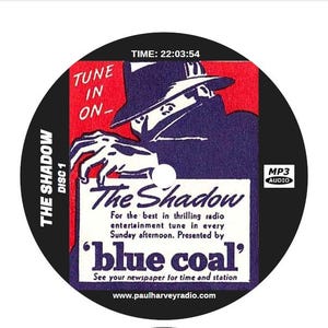May include: A black CD featuring a vintage graphic for "The Shadow" radio show. The design includes a fedora-wearing figure, the show's title, and text promoting the program. The disc also has "MP3 AUDIO" and "DISC 1" labels.