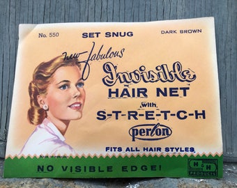 May include: A vintage package for a dark brown hair net. The package features a woman with a hairstyle and the text "new fabulous Invisible HAIR NET with S-T-R-E-T-C-H perlon FITS ALL HAIR STYLES NO VISIBLE EDGE! H&H PRODUCTS".