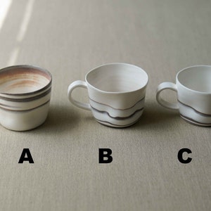 Ocean Waves vitglaserad te-/kaffemugg
