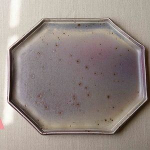 May include: A light purple octagonal ceramic serving tray with a speckled glaze.