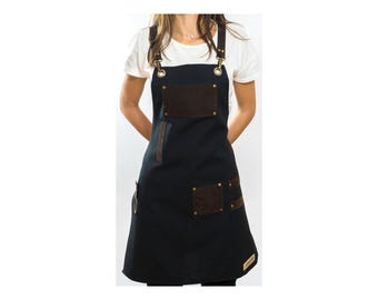 Delantal de diseño negro con correas y bolsillos para baristas, peluqueros, barberos, maquilladores, chefs y bartenders.