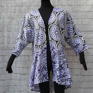 Purple duster Loosefitting,lightweight cotton,duster cover-up kimono jacket. Flounce hemline.Medallions+batik pattern.Hook closure. Washable