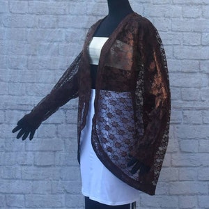 Sheer mocha brown lace lightweight cocoon kimono cover-up.Dropped shoulders , buttonless front placket,long sleeves , unlined.Easy, breezy.