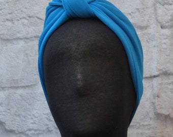 Easy fun joyful reversible stretchy blue Bandie headband.Soft,comfortable and adjustable  100% spandex fabric. Solid color.Machine washable.