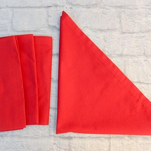 These dinner size cotton napkins are a solid smoky red color.Napkins are topstitched and sewn with mitered corners.  Machine washable.