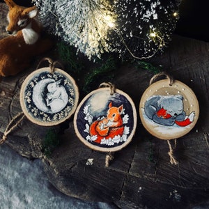 Christmas tree ornament. Hand painted wood slice holiday decoration. Forest animals and snow winter scene tree ornaments. Christmas gift