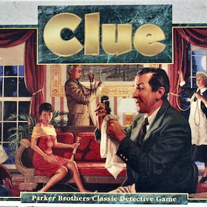 May include: The board game Clue is displayed, featuring a classic detective theme. The game's title is in gold lettering against a green marble background. The box art depicts a detailed illustration of a room with several characters, including a woman in a red dress.