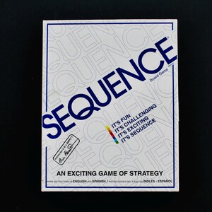May include: A white board game box with the word "SEQUENCE" in large blue letters. The box also features the text "IT'S FUN, IT'S CHALLENGING, IT'S EXCITING, IT'S SEQUENCE". The box is for "AN EXCITING GAME OF STRATEGY".