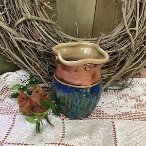 Copper and Multidimensional blue, brown and green glaze vase.