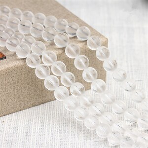 6-16mm Natural Clear Quartz Frosted Round with Om Mani Padme Hum Beads Strand (CS025)