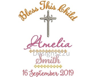May include: A white background with a silver cross and the text "Bless This Child" in orange. Below the cross is the name "Amelia Smith" in pink with a gold design. The date "16 September 2019" is also in pink.