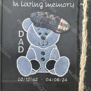 May include: A framed memorial art piece with a blue teddy bear wearing a plaid cap. The text "In loving memory" and "DAD" are above the bear. Dates 02/12/42 - 04/06/24 are below. The words "Digital Download" are at the bottom.