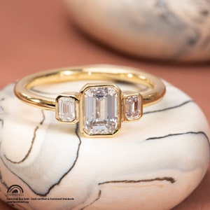 Emerald Cut Trio Ring in Fairmined Certified Gold