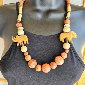 Vintage Wood Carved Lion & Rhino Pendant Necklace, African Safari Tribal Jewelry, Retro Boho Jungle Chunky Wood Bead Statement Jewelry